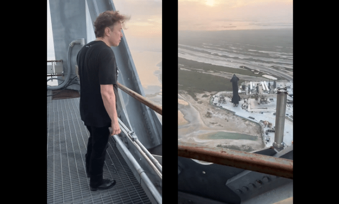 elon musk looking at starbase texas from a platform