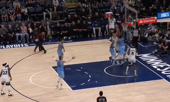 protestor tackled at target center in minnesota during timberwolves vs grizzlies nba playoff game 4 2022